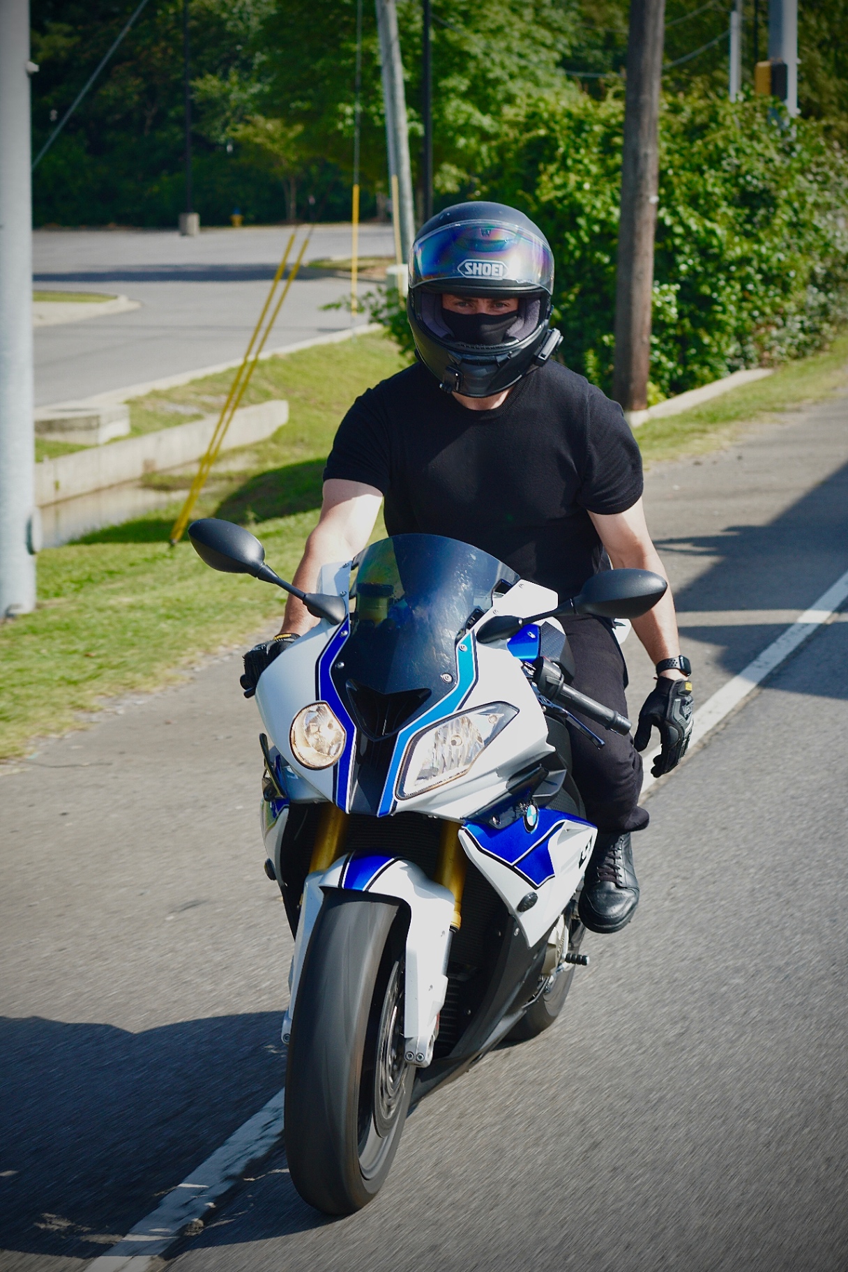 Rider on a BMW sportbike captured mid-ride.